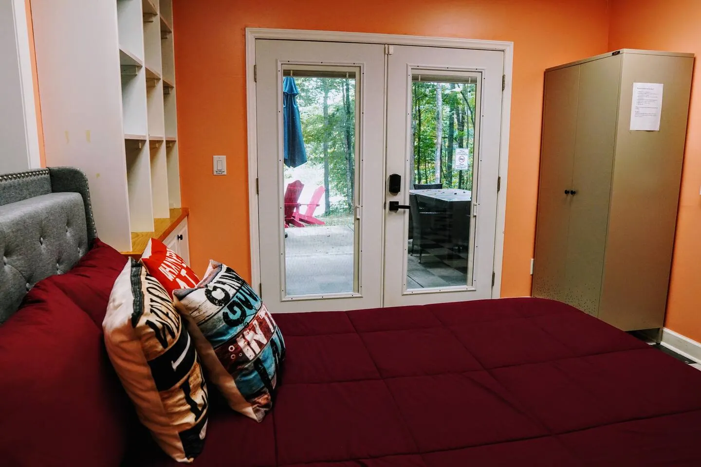 Lower-level bedroom with French doors opening to the patio and Mayo Lake