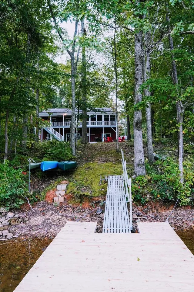 Stairs leading down through the trees to the dock and shoreline